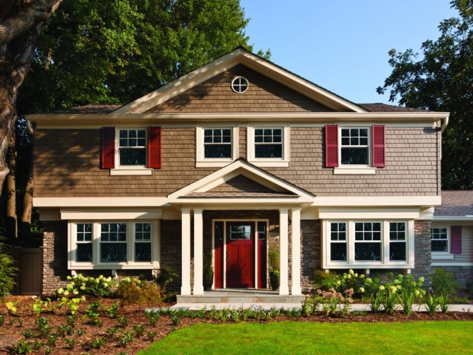 A home with new siding and a freshly installed roof, showcasing a significant improvement in curb appeal in Northwest Ohio.