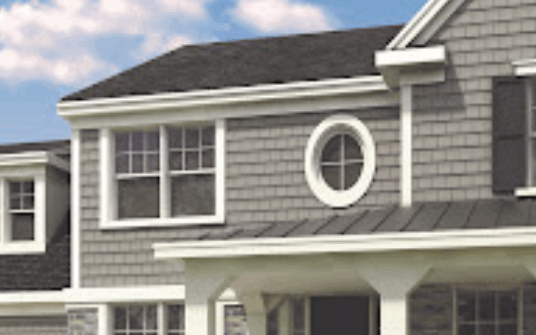 Contemporary home with shake siding and stone accents, ideal for window and door upgrades