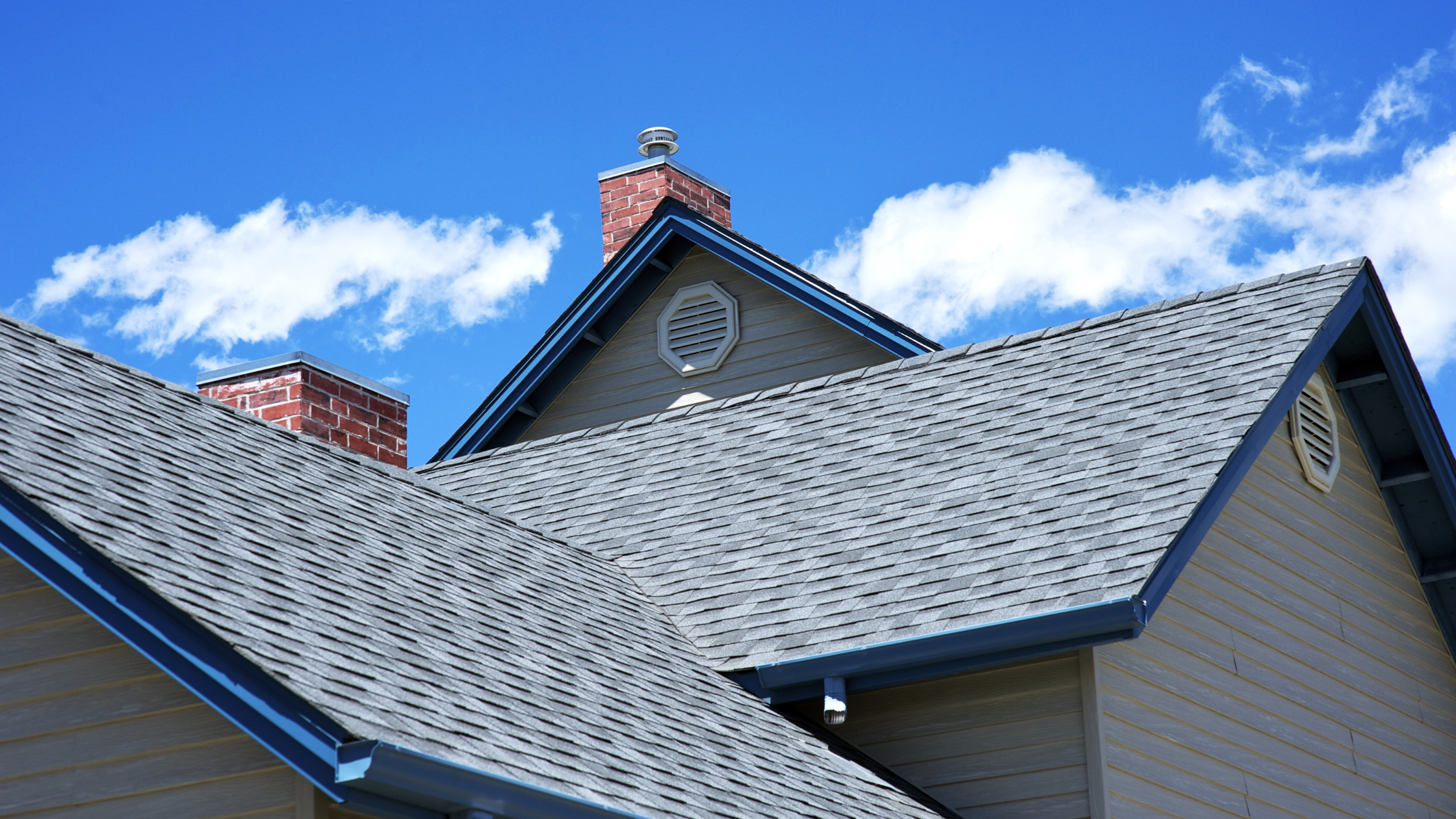 A close-up of a home in Northwest Ohio with new, durable siding and a recently installed roof, symbolizing protection from severe weather.